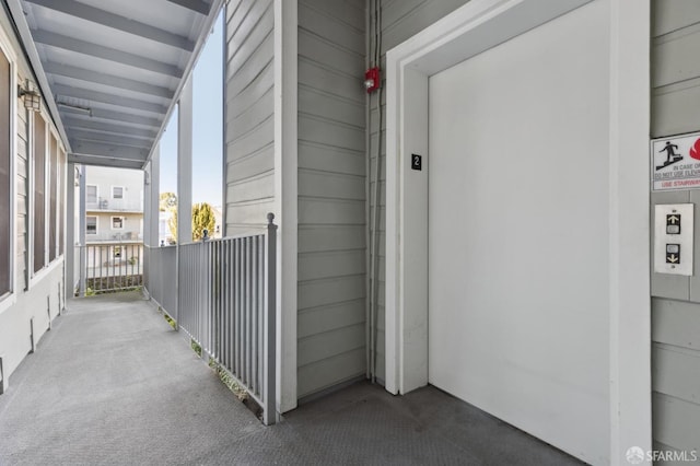 exterior space with a balcony and elevator