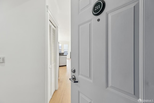 hall with light wood-type flooring