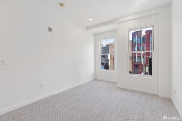 empty room featuring light carpet