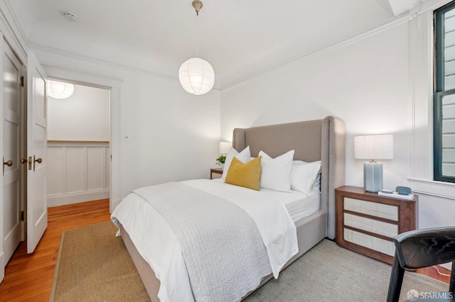 670 Page St, San Francisco, CA 94117 - bedroom with wood finished floors, crown molding, and a wainscoted wall