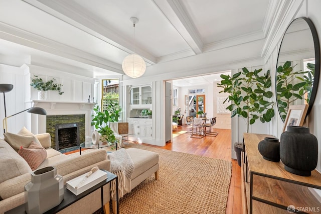 670 Page St, San Francisco, CA 94117 - living area with a fireplace, light wood-style floors, beam ceiling, and crown molding