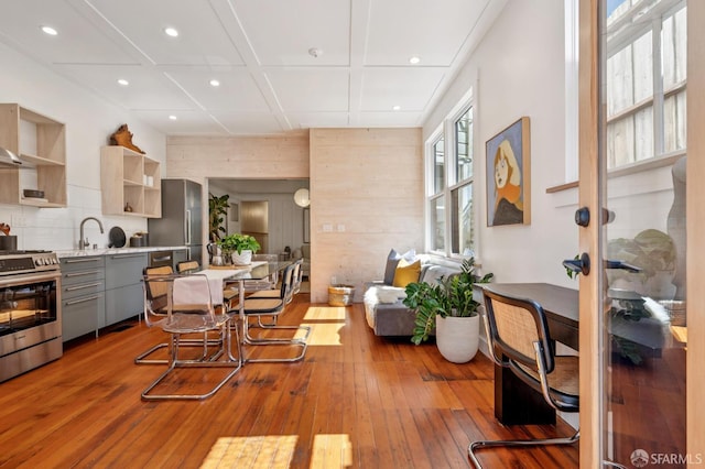 670 Page St, San Francisco, CA 94117 - kitchen featuring gray cabinetry, stainless steel range with electric stovetop, open shelves, light countertops, and wood-type flooring