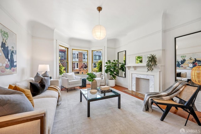 670 Page St, San Francisco, CA 94117 - living room with healthy amount of natural light, a premium fireplace, and light wood-style floors