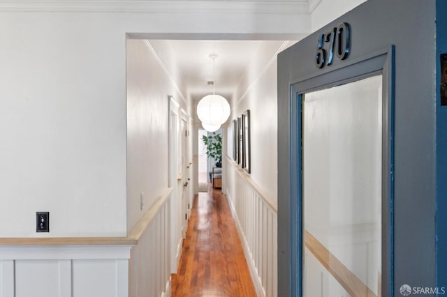 670 Page St, San Francisco, CA 94117 - corridor with light wood-type flooring, crown molding, a decorative wall, and wainscoting