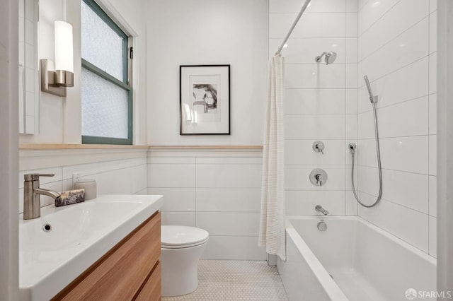 670 Page St, San Francisco, CA 94117 - full bath featuring tile walls, vanity, shower / tub combo with curtain, tile patterned floors, and wainscoting