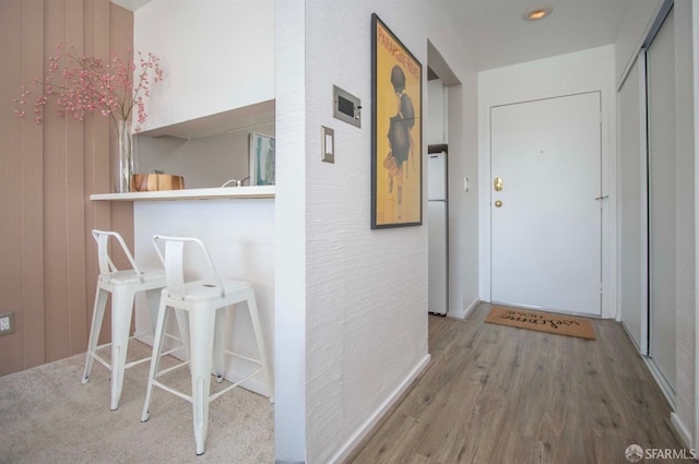 corridor with wood finished floors