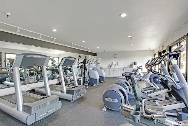 gym with recessed lighting and rail lighting