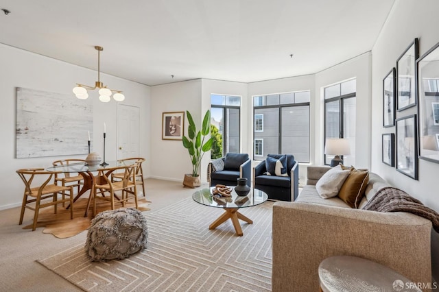 1805 Fillmore St Unit 302, San Francisco, CA 94115 - carpeted living room with baseboards and a chandelier