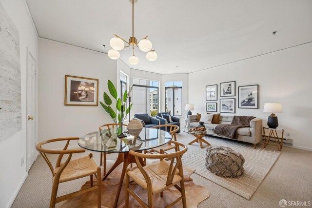 1805 Fillmore St Unit 302, San Francisco, CA 94115 - dining area featuring carpet flooring, baseboards, a chandelier, and a baseboard heating unit