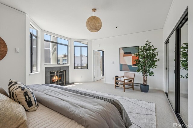 1805 Fillmore St Unit 302, San Francisco, CA 94115 - bedroom with carpet flooring, a lit fireplace, and baseboards