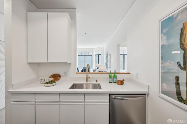 1805 Fillmore St Unit 302, San Francisco, CA 94115 - kitchen featuring dishwasher, a sink, white cabinets, and light countertops