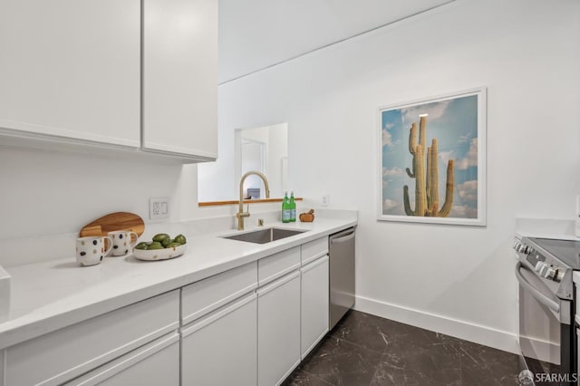 1805 Fillmore St Unit 302, San Francisco, CA 94115 - kitchen with a sink, stainless steel appliances, dark marble finish flooring, baseboards, and white cabinets
