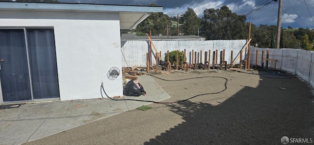 view of yard with a fenced backyard and a patio area