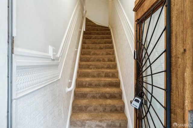 stairs featuring carpet