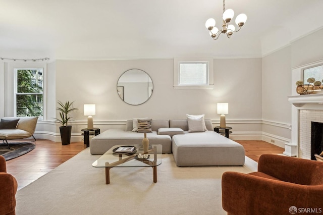 living room featuring hardwood / wood-style flooring, a healthy amount of sunlight, and a fireplace