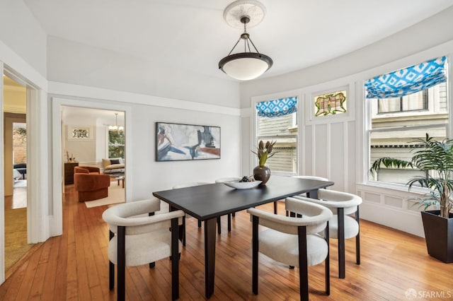 dining area with light hardwood / wood-style flooring