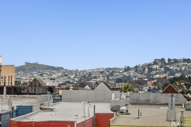 property's view of city featuring a mountain view