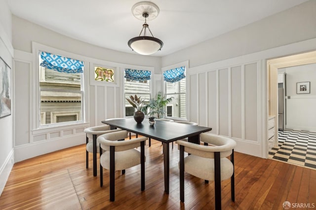 dining space featuring hardwood / wood-style floors