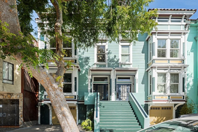 2553 Folsom St Unit A, San Francisco, CA 94110 - view of front facade with stairway and an attached garage