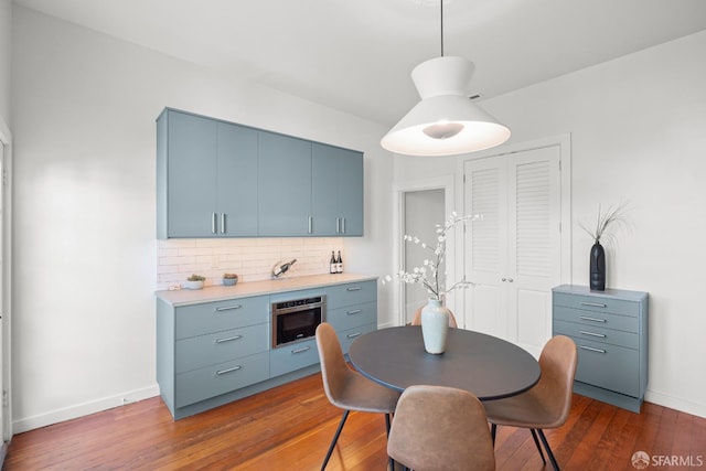 2553 Folsom St Unit A, San Francisco, CA 94110 - dining area with dark wood-style floors and baseboards