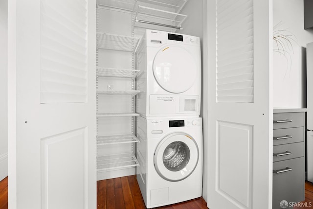 2553 Folsom St Unit A, San Francisco, CA 94110 - washroom with stacked washer and clothes dryer and dark wood-style flooring