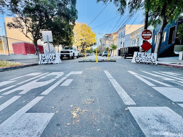 2553 Folsom St Unit A, San Francisco, CA 94110 - view of asphalt road with traffic signs, curbs, and sidewalks