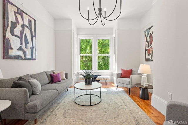 2553 Folsom St Unit A, San Francisco, CA 94110 - living room featuring wood finished floors, a chandelier, and baseboards
