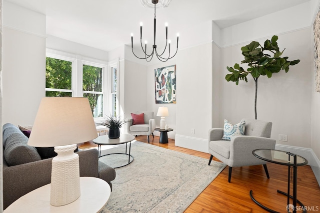 2553 Folsom St Unit A, San Francisco, CA 94110 - living area featuring a chandelier, wood finished floors, and baseboards