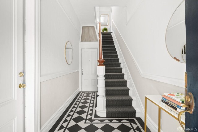 2553 Folsom St Unit A, San Francisco, CA 94110 - stairway featuring tile patterned floors and baseboards