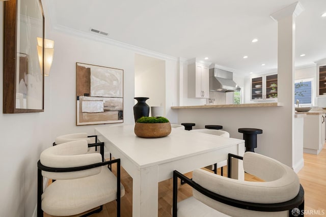 803 Vermont St, San Francisco, CA 94107 - dining space featuring light wood finished floors, crown molding, and recessed lighting