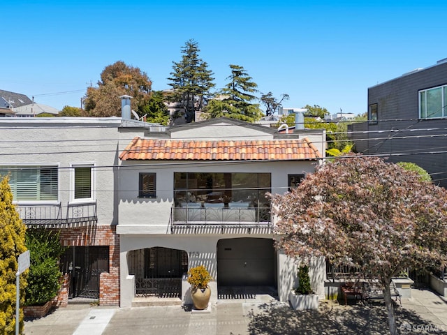 803 Vermont St, San Francisco, CA 94107 - back of house featuring stucco siding, a balcony, and a tile roof