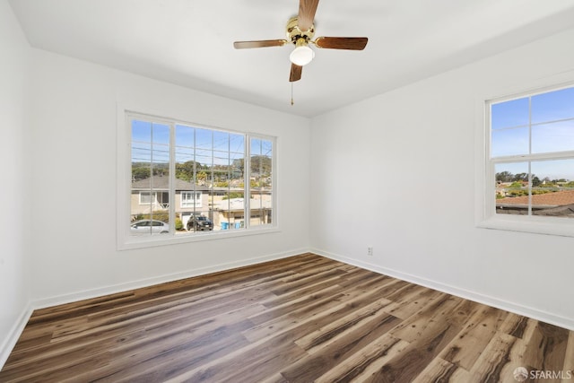 556 Cherry Ave, San Bruno, CA 94066 - unfurnished room with dark wood-style floors, baseboards, and a ceiling fan