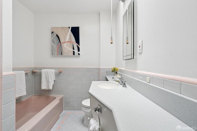2421 Quintara St, San Francisco, CA 94116 - full bathroom with a garden tub, tile patterned flooring, wainscoting, vanity, and tile walls