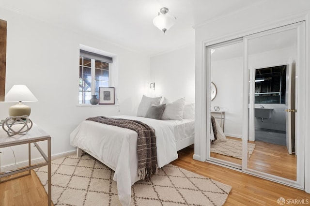 2421 Quintara St, San Francisco, CA 94116 - bedroom featuring ornamental molding and wood finished floors