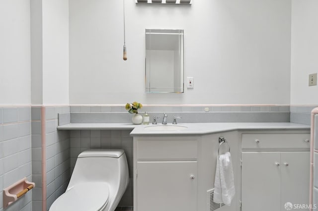 2421 Quintara St, San Francisco, CA 94116 - half bath featuring vanity, tile walls, and a wainscoted wall