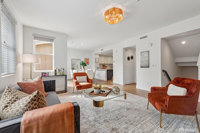 living room with light hardwood / wood-style floors