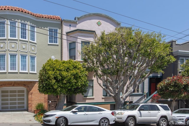 4632 18th St, San Francisco, CA 94114 - view of front of house featuring brick siding, a garage, and stucco siding