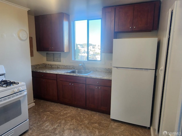 kitchen featuring sink and white appliances