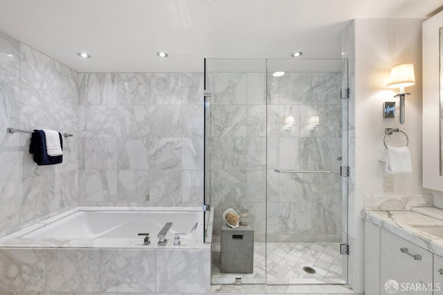 full bath with a garden tub, a shower stall, and vanity