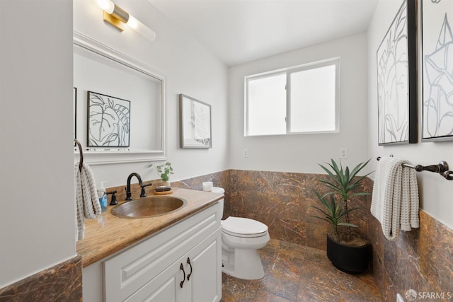 245 Skyline Dr, Daly City, CA 94015 - bathroom with vanity, stone finish flooring, wainscoting, and tile walls