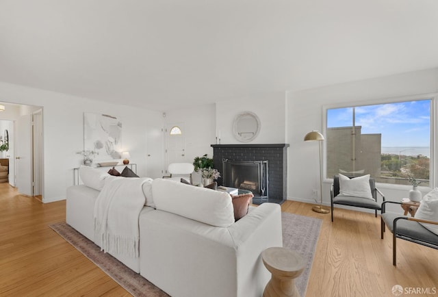 245 Skyline Dr, Daly City, CA 94015 - living room with light wood finished floors and a brick fireplace