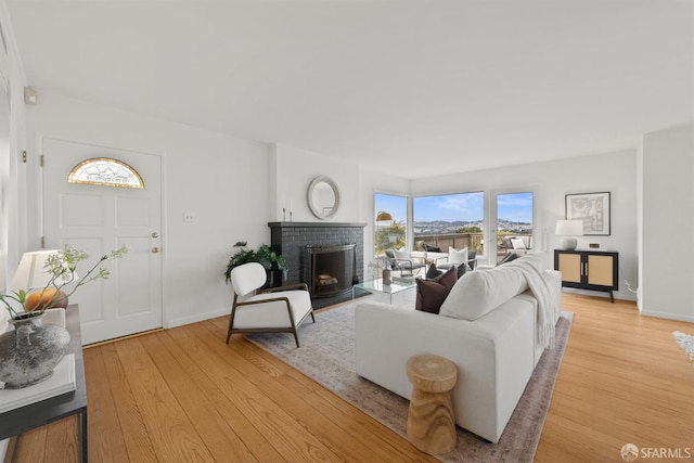 245 Skyline Dr, Daly City, CA 94015 - living room with a fireplace and light wood-style floors