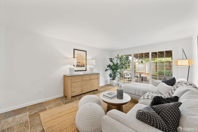 245 Skyline Dr, Daly City, CA 94015 - living room featuring baseboards and light stone finish flooring