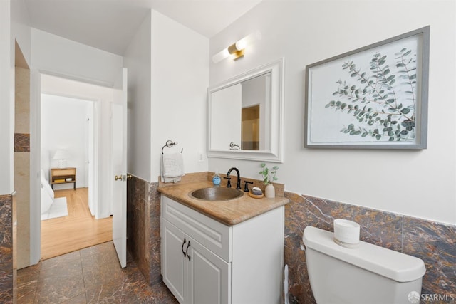 245 Skyline Dr, Daly City, CA 94015 - bathroom with tile walls, vanity, a wainscoted wall, and marble finish flooring