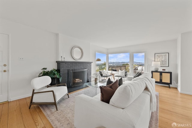 245 Skyline Dr, Daly City, CA 94015 - living area featuring a brick fireplace and light wood-style flooring