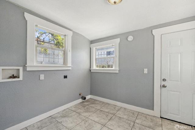 laundry room featuring baseboards, a wealth of natural light, laundry area, and hookup for a washing machine