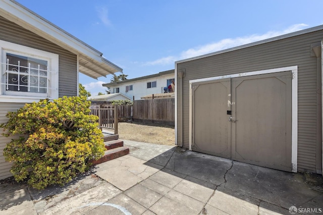 view of shed with fence