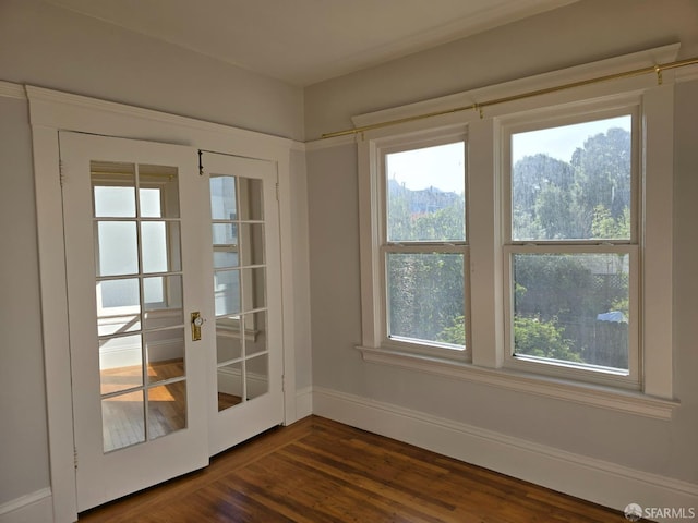 doorway to outside with french doors and dark hardwood / wood-style flooring