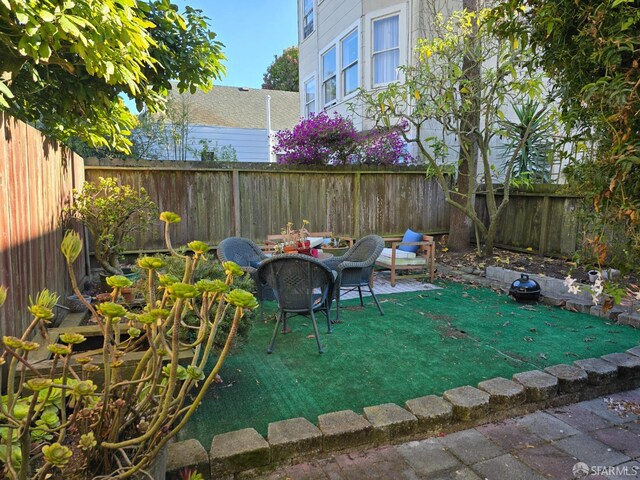 view of patio / terrace with an outdoor fire pit