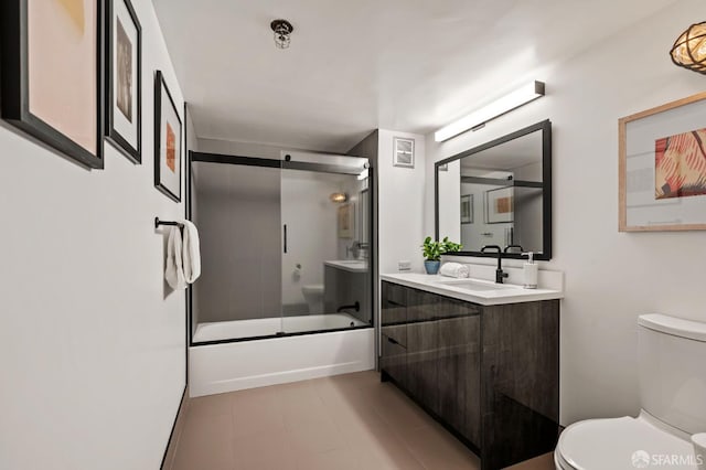 461 2nd St Unit C135, San Francisco, CA 94107 - bathroom featuring toilet, vanity, and combined bath / shower with glass door